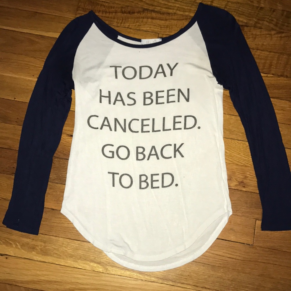 2 navy blue and white long sleeve tees